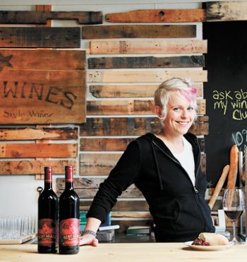 Remy Drabkin hosts behind the bar at baR (pronounced R Bar), Remy Wines’ tasting room located adjacent to the winery in McMinnville. Photo by Ben Garvey.