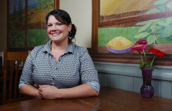 Rockne Roll // DYV
Owner Nora Lamb poses at a table in The Crescent Café.