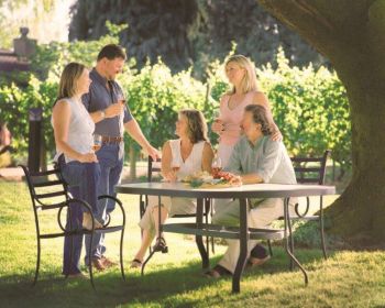 <b>Luisa (far left), Michel and Maria Ponzi (standing) join their parents, Nancy and Dick Ponzi for a toast.</b>